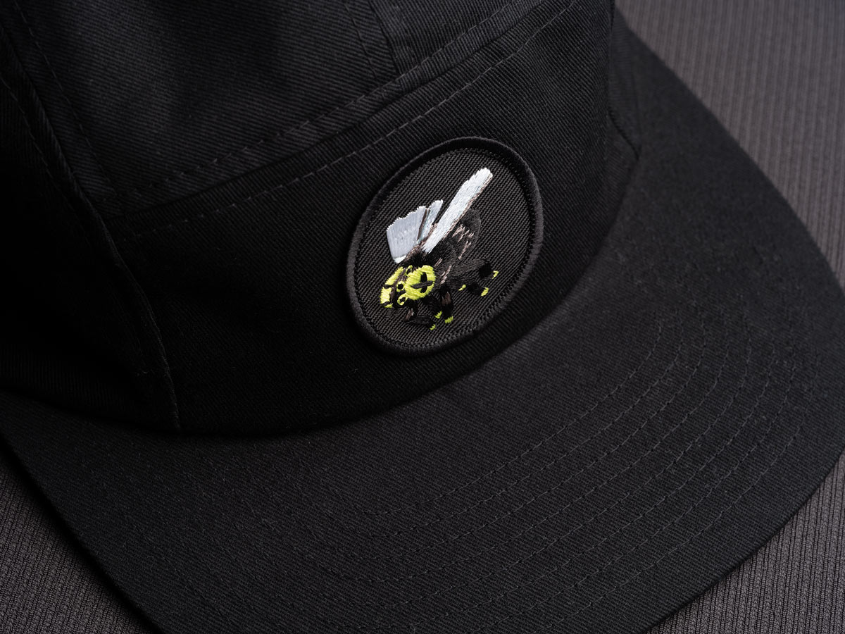 MUTATIO patch on a cap